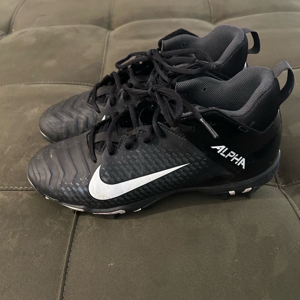 Nike Alpha Black and White Cleats. Size 7W. Excellent used condition.
